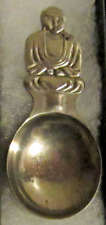 #73) PRESSED METAL TEA CADDY SPOON SITTING MONK FIGURE