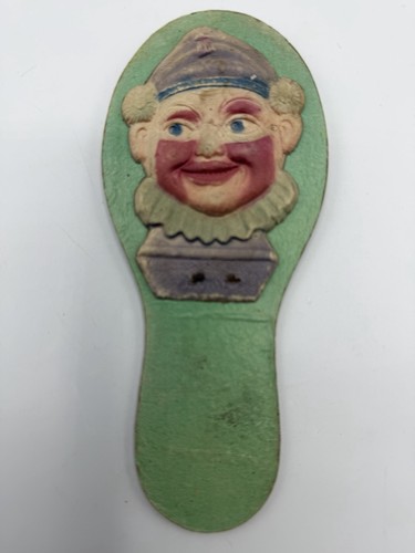 Antique embossed clown clapper - embossed,