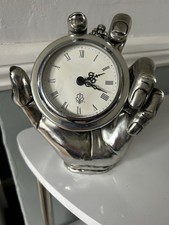 Clock In Hand Polished Metal Clock