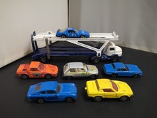 M609-CORGI JUNIORS MERCEDES BENZ CAR TRANSPORTER AND SIX MODELS