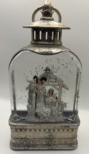 Nativity snow globe lights up