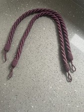 PAIR OF BURGUNDY-WINE COLOURED ROPE CURTAIN TIE BACKS - 33” LONG