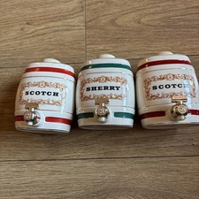 WADE POTTERY THREE SMALL BARREL DECANTERS TWO X SCOTCH 1 X SHERRY