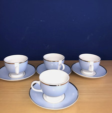SET OF FOUR ROYAL DOULTON 2004 COFFEE CUPS AND SAUCERS. (1)