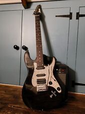 An electric guitar  and an amp with the cable