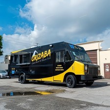 Stylish Yellow-Black Food Truck with Nature Design - Great for Catering