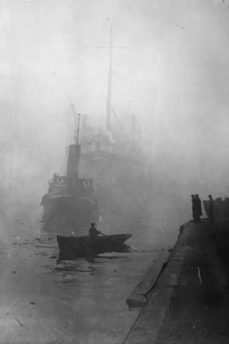 Tug towing boat down - a, the