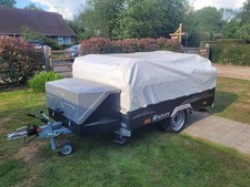 RACLET QUICKSTOP SE TRAILER TENT WITH AWNING, SUN CANOPY AND UNDER BED TENTS.