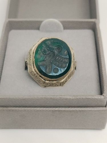 Metal figural seal ring with - seal,