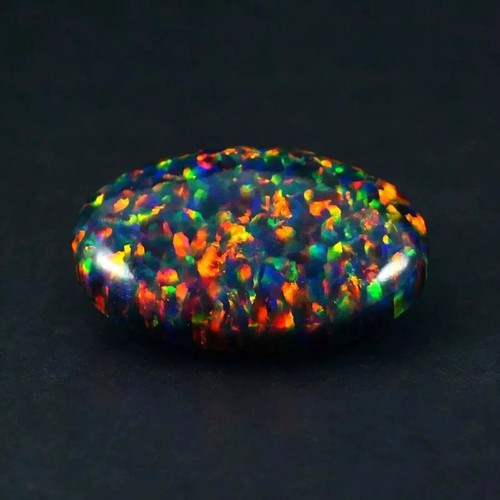 Natural black fire opal - black, oval
