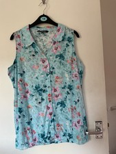 Ladies sleeveless blouse. size 14.  Bubble hem.