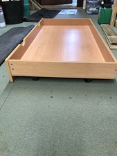 Pine Wooden under bed   drawer on wheels.    See Photos