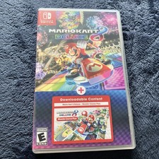 Mario Kart 8 Deluxe + Booster Course Pass - Nintendo Switch DLC on the cart 