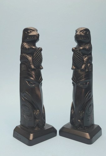 Pair totem pole statue - of,