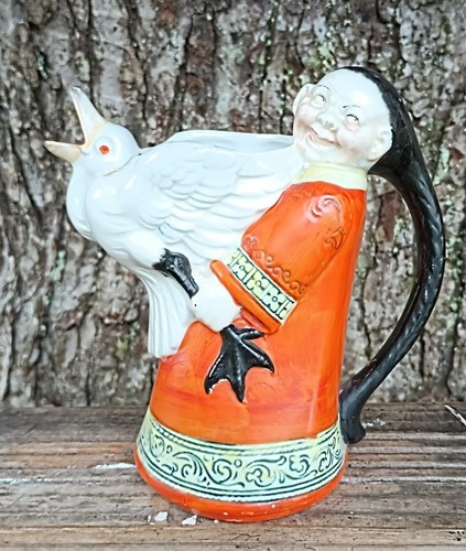 Chinaman holding goose - chinaman,