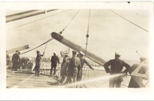 HMS Malaya. "Hoisting In Torp