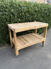 A Two Tier Wooden Workbench On