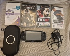 Sony PSP 1003 Black with Case 1GB Mem Card & 4 Games & 6 movies. See Description