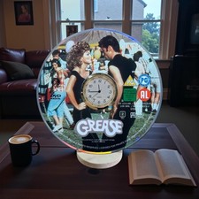 Grease Novelty Desktop DVD Clock With Fixed Metal Insert And Display Stand