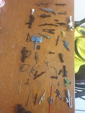 mixed lot of collectable plastic accessories toy weapons and bits in old box