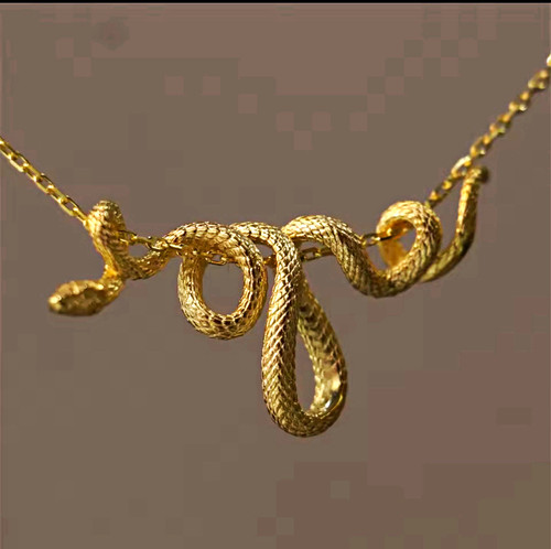 Gold tone snake charm necklace - gold,