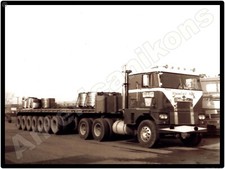 Diamond REO Trucks New Metal Sign: Brada Miller COE w/ Flatbed Steel Trailer