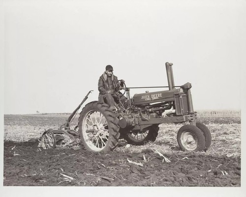 Man driving john deere tractor - driving,