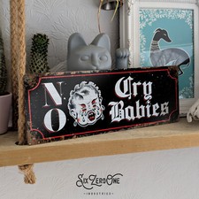 No cry babies metal sign