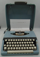 BROTHER INDUSTRIES LTD BLUE PORTABLE TYPEWRITER & CASE PLEASE READ