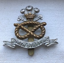 North Staffordshire Regiment cap badge.