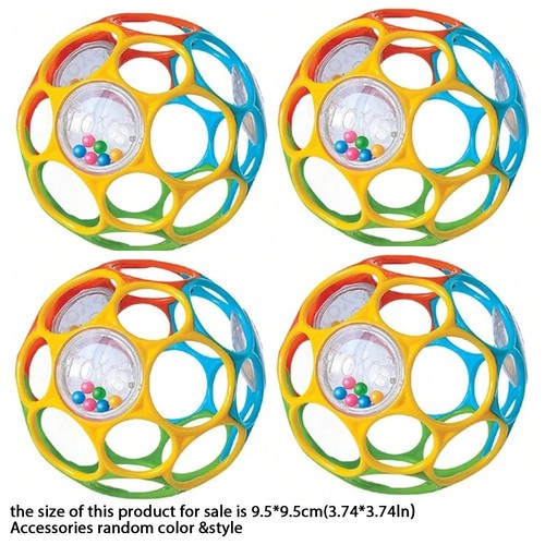 Baby grasping rattle ball with - baby,