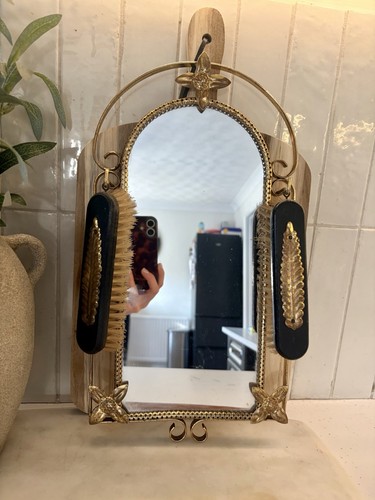 Antique brass wall mirror and
