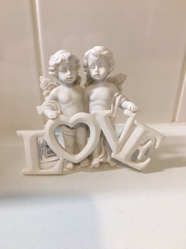 Two cherubs holding - two,