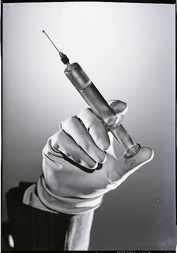 Gloved hand holding - , a