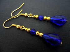 A PAIR OF COBALT BLUE CRYSTAL  GOLD PLATED  TEARDROP  EARRINGS. 