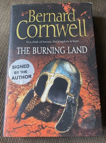 Signed the burning land - **signed.,