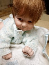 Porcelain doll from Ashton Drake Collection 'Snug as a Bug in a Rug'