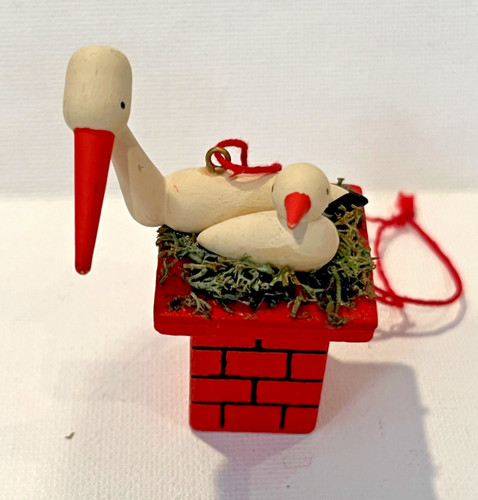 Stork mama and baby atop - stork,