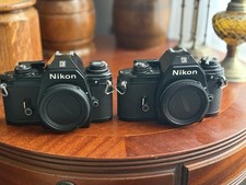 2 Nikon EM SLR Cameras Good Conditions and Working Order.