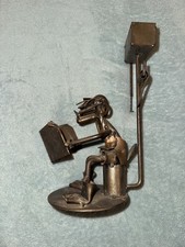 Scrap Metal Art Sculpture Man reading paper on toilet H3