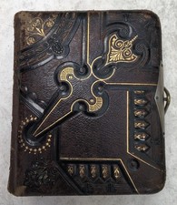 HEAVILY TOOLED LEATHER COVERED