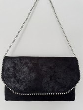 black faux suede evening bag with stud detail.