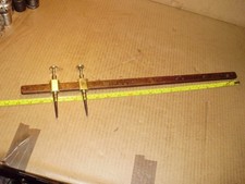 Vintage 5 1/4", 2 brass & steel trammels on hardwood beam