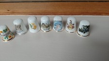 7 VINTAGE DECORATIVE BONE CHINA THIMBLES.