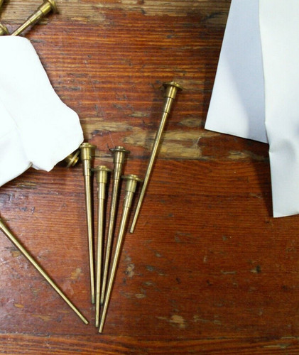 Metering needles biased - needles,