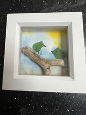 Two little birds.  Sea glass art with driftwood branch . Deep box frame .White