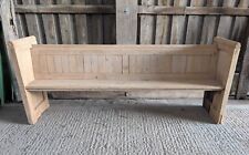 A STRIPPED PINE PEW MADE USING RECLAIMED PEW ELEMENTS M2062