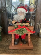 Animated Father Christmas Figure Playing Piano With Sound.
