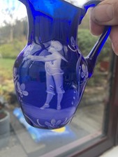 A lovely Mary Gregory style cobalt blue jug excellent condition.