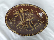 Jean Hampton large oval slipware studio pottery dish with fish design,circa 1960